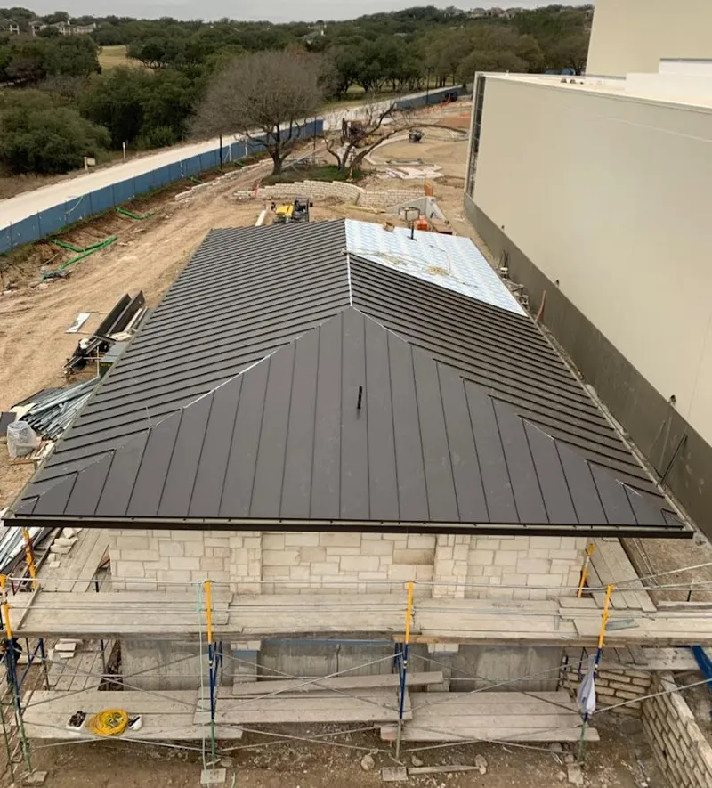 Metal roof new construction with scaffolding in Hermitage