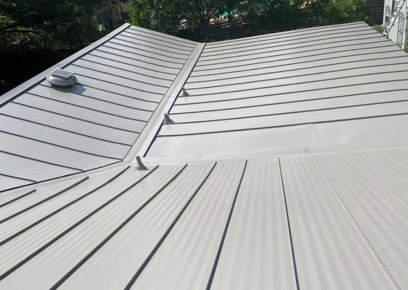 Solar attic fan installed on a metal roof for Roof Ventilation in Hermitage